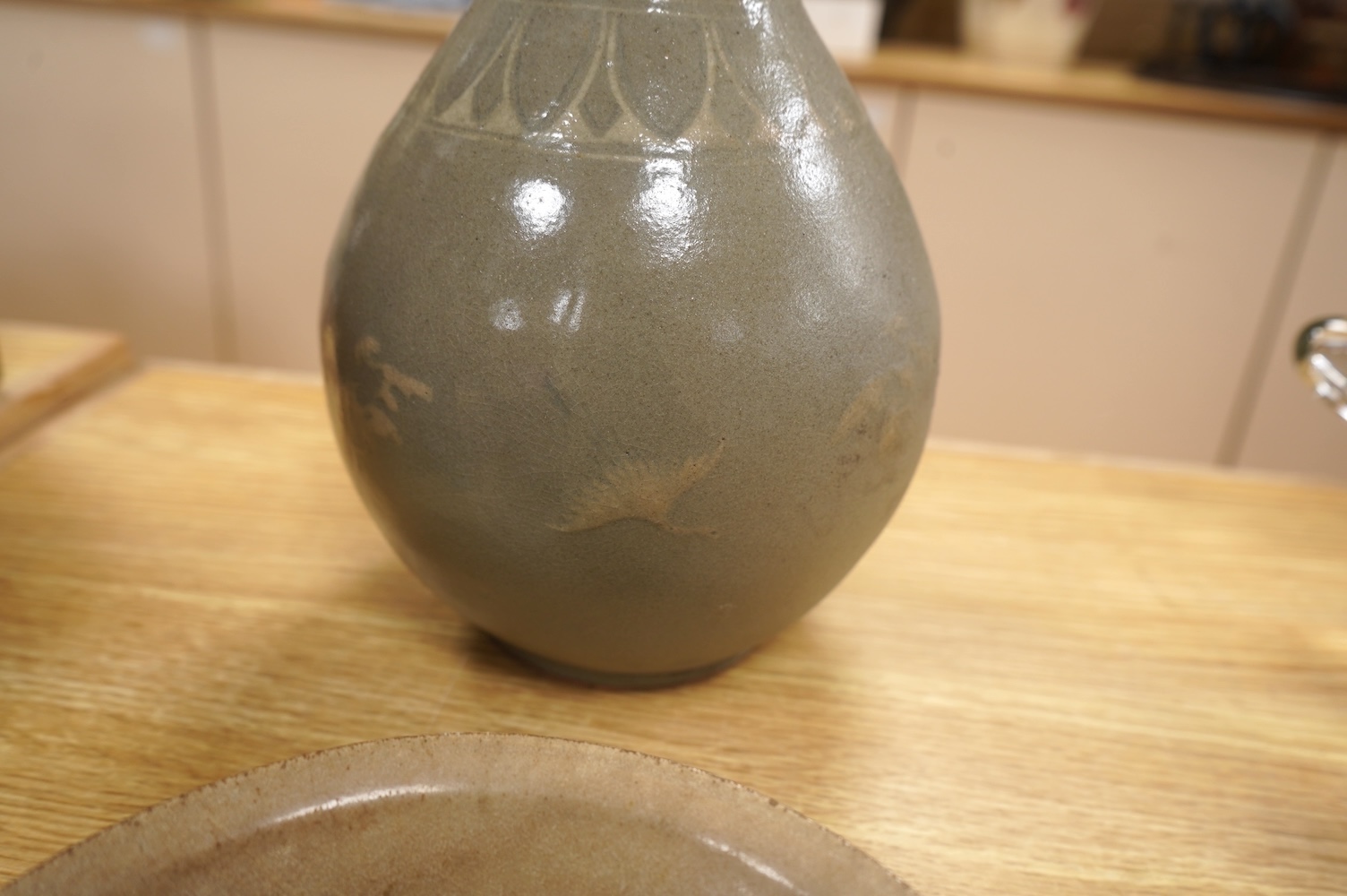 Five pieces of Chinese/Korean celadon comprising three bowls and two vases, 31cm high. Condition - some breaks